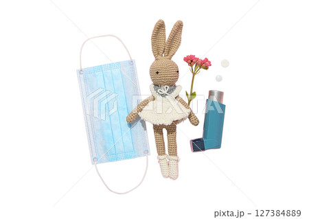 Crocheted rabbit with health items, isolated on white background Crocheted rabbit with health items, isolated on white background 127384889