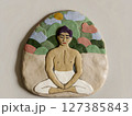 Clay Art of Meditating Man in Nature 127385843