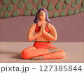 Clay Figurine of Woman in Yoga Pose 127385844