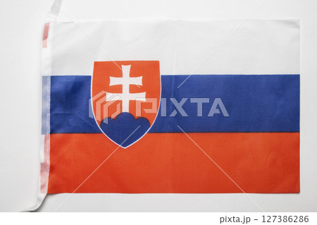 Closeup view of the Slovakia national flag isolated over a white background. Concept of government and nationality 127386286