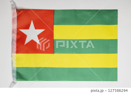 Closeup view of the Togo national flag isolated over a white background. Concept of government and nationality 127386294