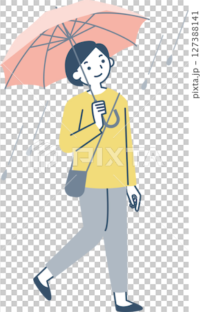 A woman walking with an umbrella on a rainy day 127388141