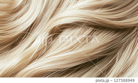 Perfectly styled blonde hair with shimmering waves and rich highlights, showcasing healthy, vibrant texture suitable for beauty and haircare visuals. Perfectly styled blonde hair with shimmering waves and rich highlights, showcasing healthy, vibrant texture suitable for beauty and haircare visuals. 127388949