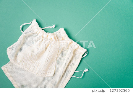 Textile eco friendly shopping bag. Zero waste concept. Plastic free concept. Top view, flat lay, copy space. Textile eco friendly shopping bag. Zero waste concept. Plastic free concept. Top view, flat lay, copy space. 127392560