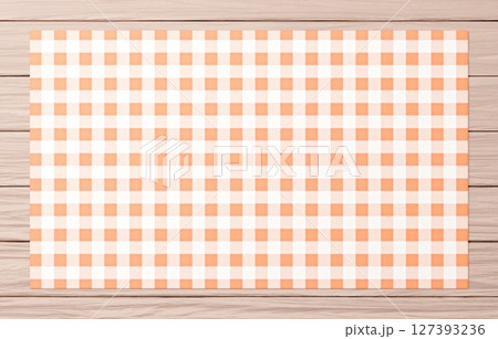 背景素材_木のテーブルと布_オレンジ 127393236