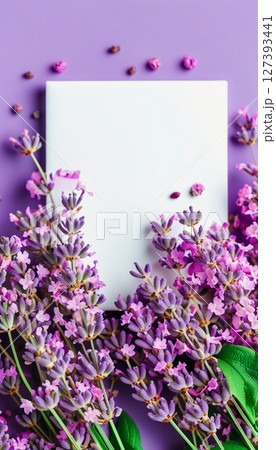 A delightful array of blooming lavender flowers creates a stunning border around a blank canvas. The vibrant purple hues enhance the artistic vibe, perfect for creative inspiration Generative AI A delightful array of blooming lavender flowers creates a stunning border around a blank canvas. The vibrant purple hues enhance the artistic vibe, perfect for creative inspiration Generative AI 127393441