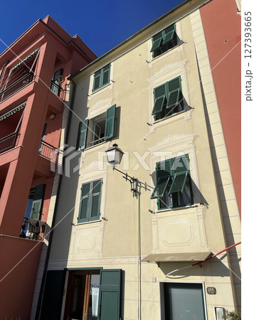 Old street in Italian countryside near sea. Traditional building. Sun day. Entrance, window to house. Background and sky. Old street in Italian countryside near sea. Traditional building. Sun day. Entrance, window to house. Background and sky. 127393665