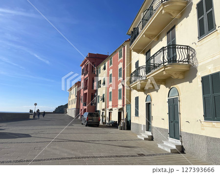 Old street in Italian countryside near sea. Traditional building. Sun day. Entrance, window to house. Nature and sky. Old street in Italian countryside near sea. Traditional building. Sun day. Entrance, window to house. Nature and sky. 127393666