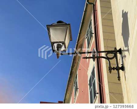 Old street in Italian countryside near sea. Traditional building. Sun day. Entrance, window to house. Background and sky. Old street in Italian countryside near sea. Traditional building. Sun day. Entrance, window to house. Background and sky. 127393668