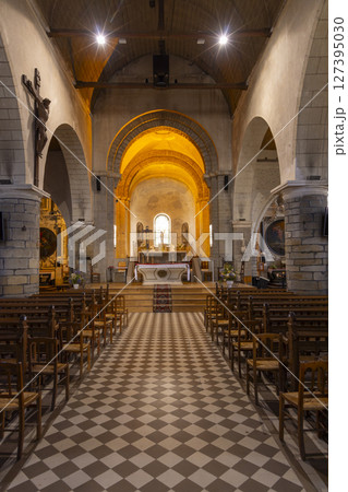 Interior of Saint Philbert Church showing altar, crucifix and wooden chairs in Noirmoutier en l'Ile, France 127395030