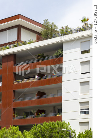 Modern apartment building with balconies and rooftop garden in Montpellier, France 127395213