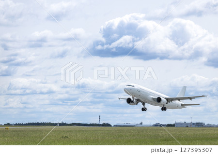White passenger airplane taking off from Airport Prague, Czechia 127395307