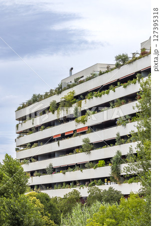 Modern building with many balconies and plants growing in Montpellier, France 127395318