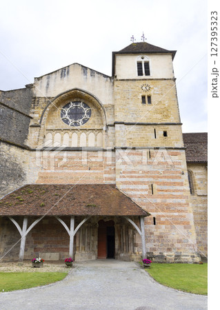 Saint Pierre Abbey Church showing its entrance and bell tower in Sorde l'Abbaye, France 127395323