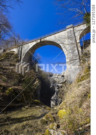 Devil's Bridge arching over a gorge in Crouzet Migette, Doubs, France Devil's Bridge arching over a gorge in Crouzet Migette, Doubs, France 127395388