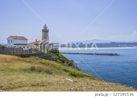 Penas Cape Lighthouse illuminating the Asturian Coast in Spain 127395536