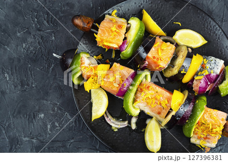 Fresh fish meat on skewers. Fresh fish meat on skewers. 127396381