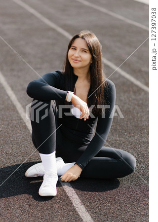Relaxing On Track Field Relaxing On Track Field 127397038