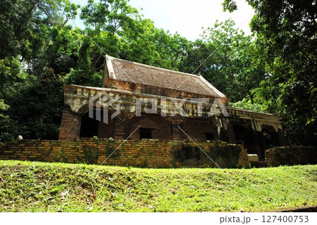 The old Buddhism church located in the forest surrounded by the trees The old Buddhism church located in the forest surrounded by the trees 127400753