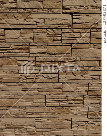 textured stone wall varying shades brown showcases natural beauty and design potential. closeup. 127402871