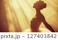 Portrait of gentle ballerina in spotlight, vintage background 127403842
