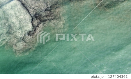 Aerial Abstraction of Foamy Turquoise Ocean Currents 127404361