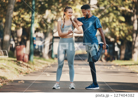 Interracial, couple and stretching for training, wellness and exercise to relax and workout in park. Health, man and woman outdoor for practice, fitness and together for bonding, healthy and talking. 127404382