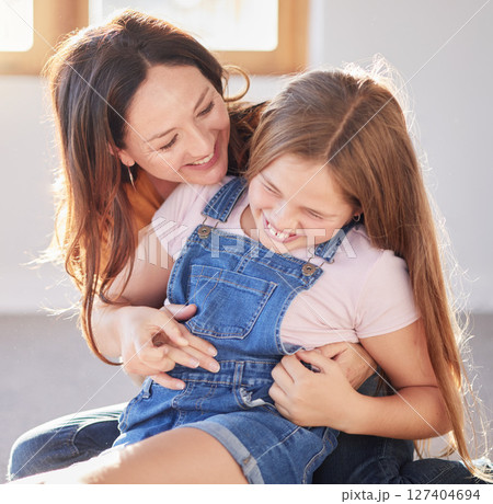 Happy, love and mother bonding with her child while playing, laughing and relaxing together at their home. Happiness, smile and woman being playful with her girl kid in their modern house in Canada. Happy, love and mother bonding with her child while playing, laughing and relaxing together at their home. Happiness, smile and woman being playful with her girl kid in their modern house in Canada. 127404694