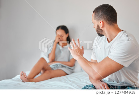 Couple, angry and marriage fight, divorce and stress in bed with mental health, abuse and mistake in relationship. Frustrated, mad and man argument and conflict with woman for infidelity in home 127404919