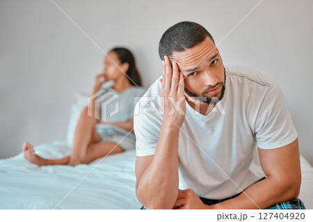 Couple, divorce and stress in home bedroom, fighting or argument. Portrait, anxiety and unhappy man and woman, sad and depressed after infidelity, toxic relationship or failed marriage in house. 127404920
