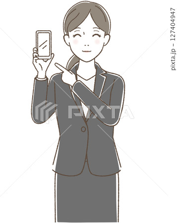 スマホを指さすスーツの女性 127404947