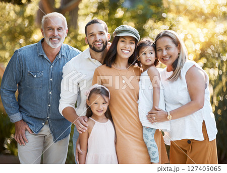 Big family, portrait and happy smile, love and support together outdoor in nature parking with care, trust and bond. Girl kids, mother and father bonding with grandparents with happiness in Amsterdam 127405065