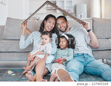 Happy family, new house and cardboard roof in living room, mortgage loan and investment security for future. Real estate, insurance and property cover for new homeowners, excited parents and children 127405104