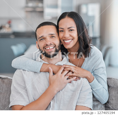 Couple, hug and portrait of a man and woman embracing for love, care and affection at home. Husband, wife and caring, romantic relationship while hugging with happiness on the living room sofa Couple, hug and portrait of a man and woman embracing for love, care and affection at home. Husband, wife and caring, romantic relationship while hugging with happiness on the living room sofa 127405194