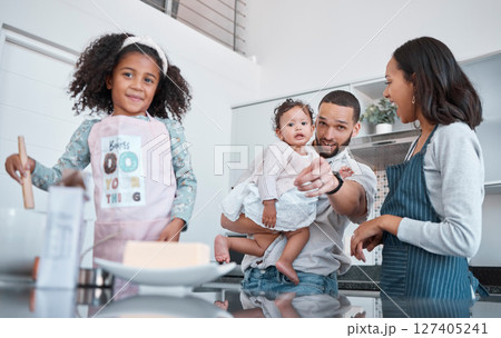 Kitchen cooking, pointing and family of happy parents, baby and children learning to bake food, bonding and having fun. Black family love, child development and mother and father teaching kids baking 127405241