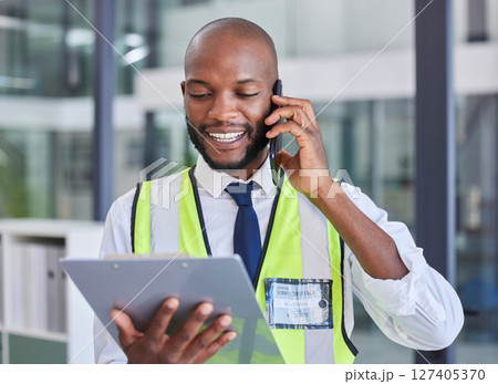 Black man with clipboard, phone call for communication during inspection, safety check and compliance. Logistics or construction with smartphone, tech and checklist for business quality assurance. 127405370