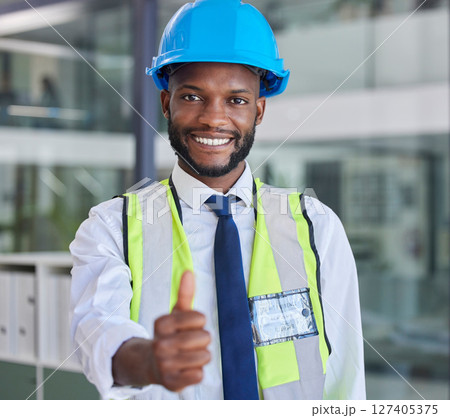Portrait, black man and engineer thumbs up for success, approval or support for construction or building project. Thank you, yes or happy architect, construction worker or contractor in safety helmet 127405375