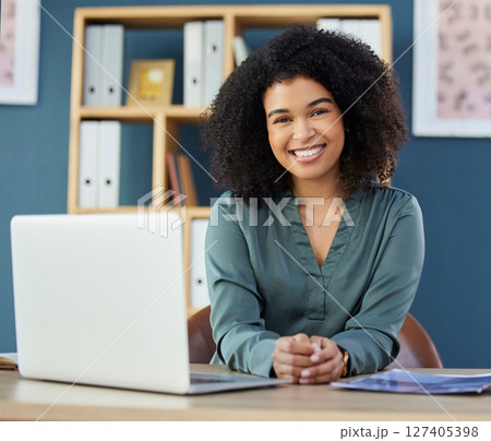 Black woman, startup business and portrait of leader, manager or boss at her desk with a laptop at marketing agency or office. Portrait of female entrepreneur happy about career choice and success 127405398