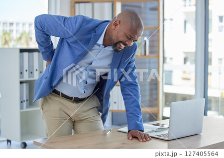 Back pain, spine and injury with businessman at desk for burnout, muscle and fatigue. Overworked, stress and accident with black man and body ache for exhausted, tired and inflammation problem 127405564