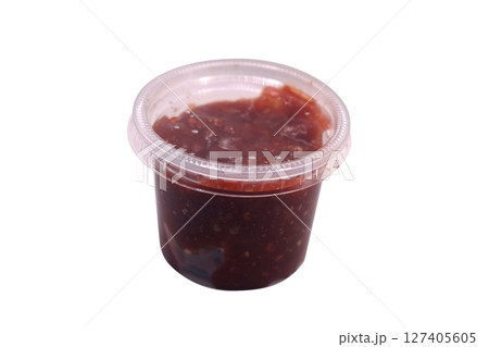 Plastic jar with a variation of sambal chili sauce with shrimp paste 127405605