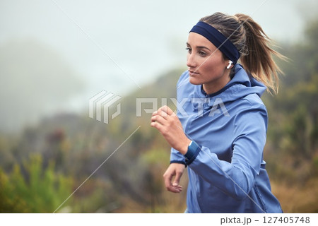 Fitness, woman and running in nature for exercise, training or cardio workout in healthy wellness. Active female runner exercising in sports run for health, endurance and wellbeing in the outdoors Fitness, woman and running in nature for exercise, training or cardio workout in healthy wellness. Active female runner exercising in sports run for health, endurance and wellbeing in the outdoors 127405748