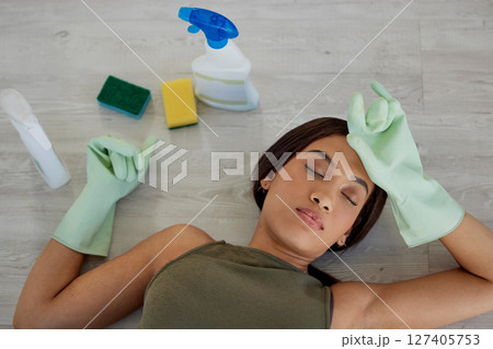 Burnout, housework and woman sleeping on floor while doing chores with rubber gloves and detergent. Sleep, house work and tired mother asleep on ground, exhausted while busy cleaning and washing home 127405753