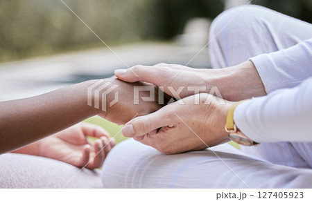 Love, support and mother holding hands with child for trust, safety and hope for foster care or adoption. Hands, diversity and interracial family connect in hope, advice and peace while bonding Love, support and mother holding hands with child for trust, safety and hope for foster care or adoption. Hands, diversity and interracial family connect in hope, advice and peace while bonding 127405923
