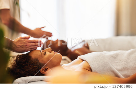Spa, luxury and black couple relax, happy and healthy treatment together for holiday, vacation and peaceful. Head, man and woman with face cosmetics, skincare or massage therapist being zen and calm. 127405996