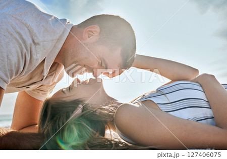 Happy, love and couple relax at beach, bonding or having fun on vacation, holiday or summer trip. Romance, support and affection of man, woman and lovers ready for romantic kiss outdoors at seashore. Happy, love and couple relax at beach, bonding or having fun on vacation, holiday or summer trip. Romance, support and affection of man, woman and lovers ready for romantic kiss outdoors at seashore. 127406075