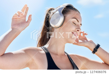 Music, summer and dance with a woman outdoor in nature against a blue sky for dancing or freedom. Radio, relax and carefree with an attractive young female streaming or listening to audio outside Music, summer and dance with a woman outdoor in nature against a blue sky for dancing or freedom. Radio, relax and carefree with an attractive young female streaming or listening to audio outside 127406076