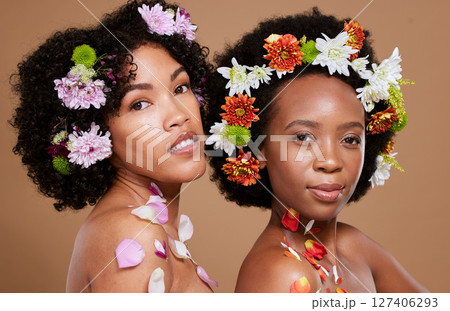 Beauty, flowers and skincare with black women friends together for natural cosmetics, makeup and self care mockup on studio background. Portrait of models for spring or floral aesthetic dermatology Beauty, flowers and skincare with black women friends together for natural cosmetics, makeup and self care mockup on studio background. Portrait of models for spring or floral aesthetic dermatology 127406293