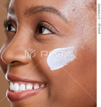 Skincare, face cream and black woman happy about health, natural wellness and dermatology. Beauty, healthy skin glow and cosmetics of woman model smile from facial lotion and anti aging moisturizer Skincare, face cream and black woman happy about health, natural wellness and dermatology. Beauty, healthy skin glow and cosmetics of woman model smile from facial lotion and anti aging moisturizer 127406400