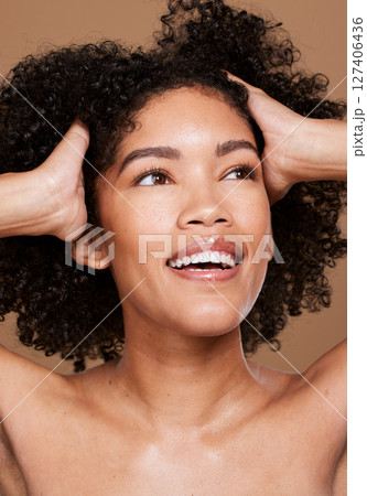 Black woman, beauty and face skincare, wellness and hair care with makeup, glow or cosmetics on brown studio background. Happy female model, facials cosmetic and happy smile for healthy or clean skin 127406436