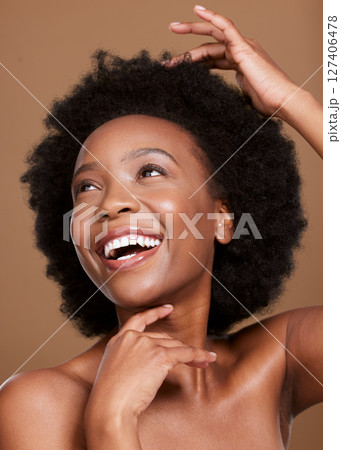 Black woman, facial skincare and hair glow with a happy smile, natural haircare health product and organic skin wellness treatment. Luxury spa, healthy cosmetic beauty and a studio background Black woman, facial skincare and hair glow with a happy smile, natural haircare health product and organic skin wellness treatment. Luxury spa, healthy cosmetic beauty and a studio background 127406478